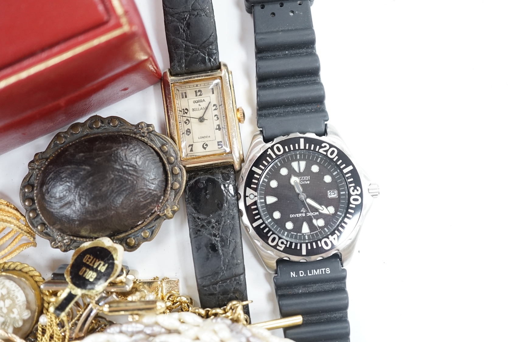 A small group of assorted costume jewellery including cufflinks, rings, brooches etc. together with two wrist watches and a Rolex box. Condition - poor to fair